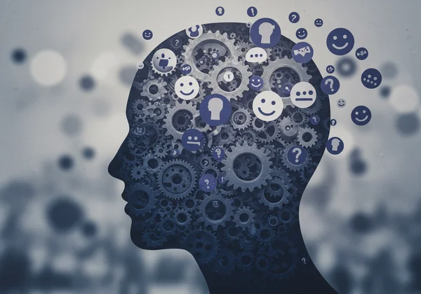 A persons head with complex gears and social symbols around it